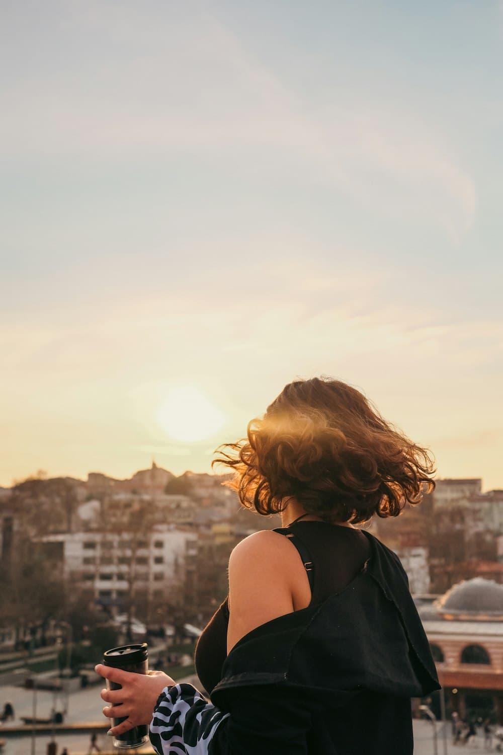 Creator looking over a city at golden hour