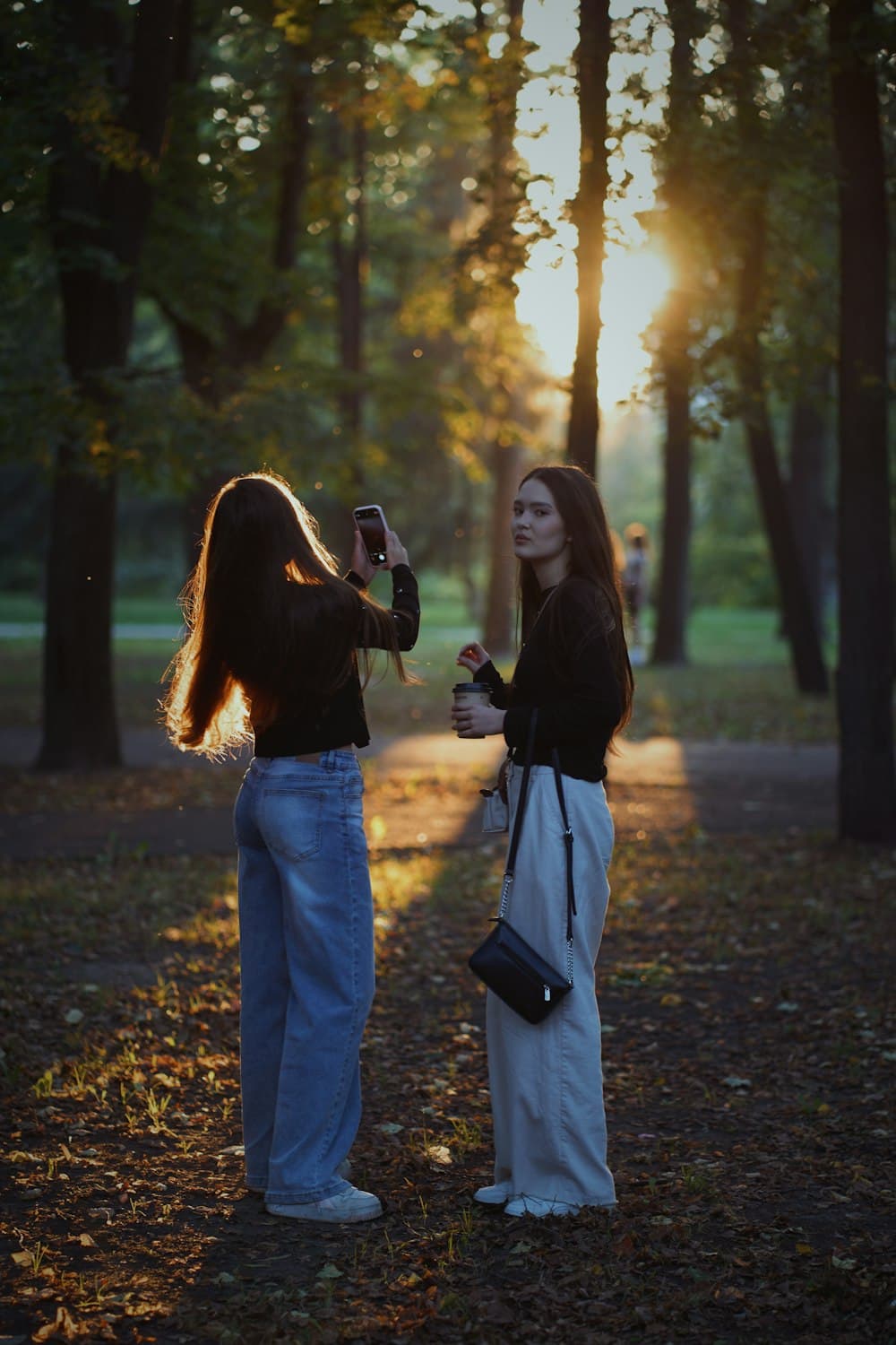 Friends creating content together in a park